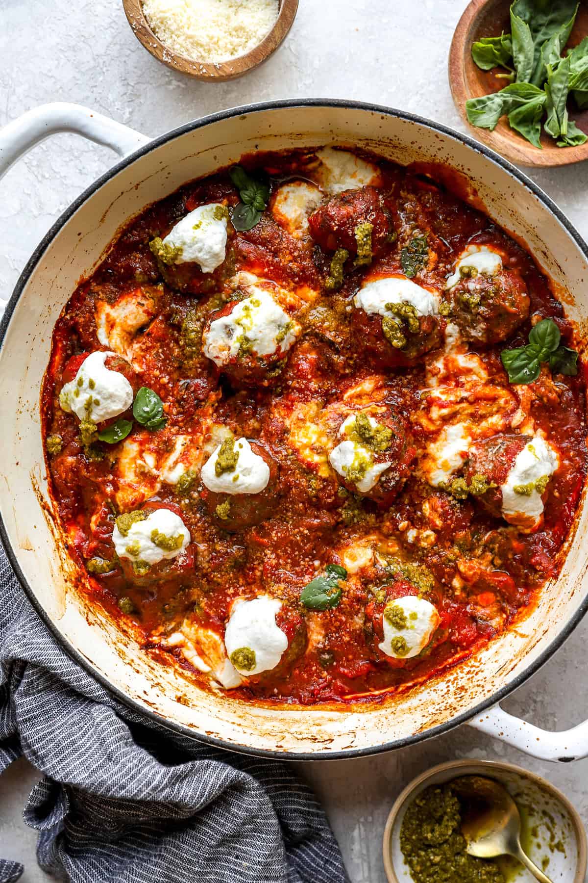 Pizza skillet meatballs topped with fresh herbs. 