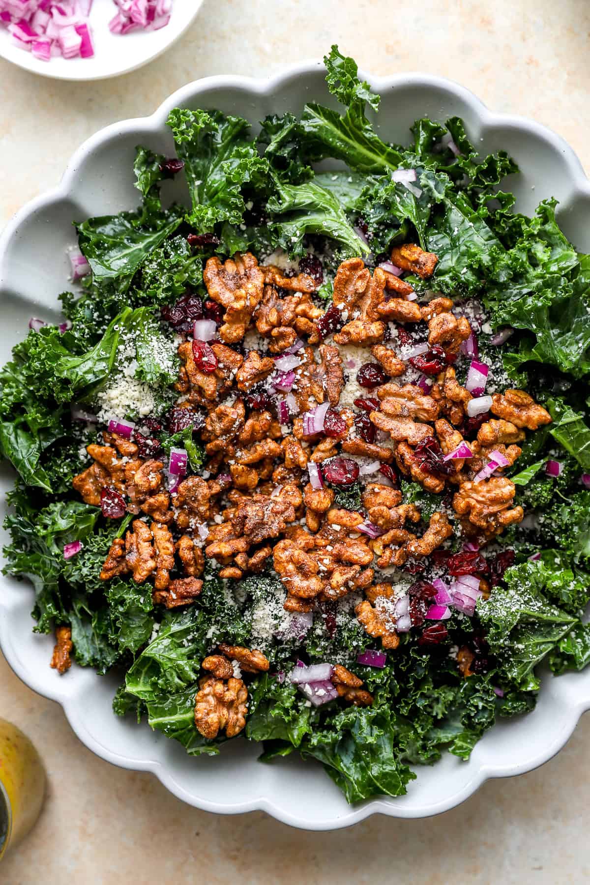 A fall kale salad with walnuts, red onion, and cheese.