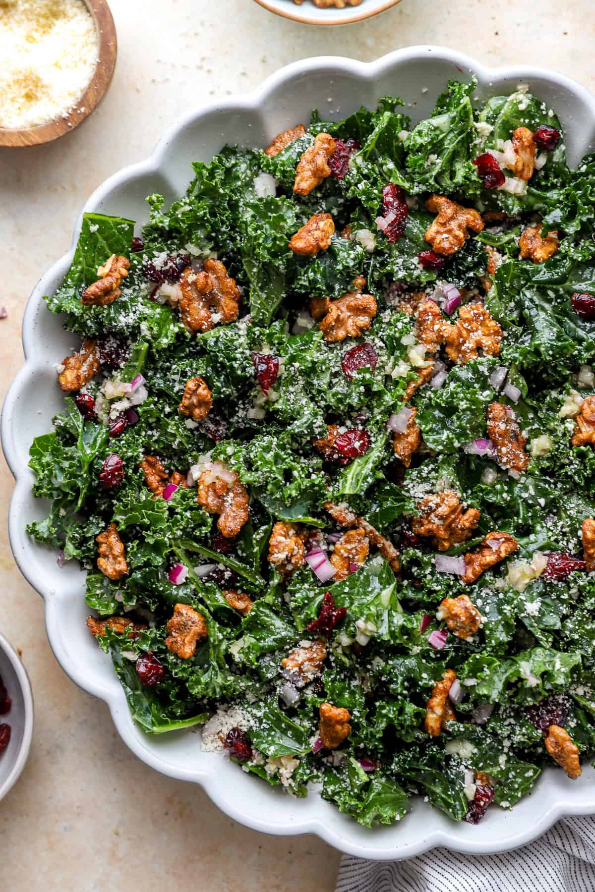 A fall kale salad with candied pecans, red onion, cheese, and shallot vinaigrette.