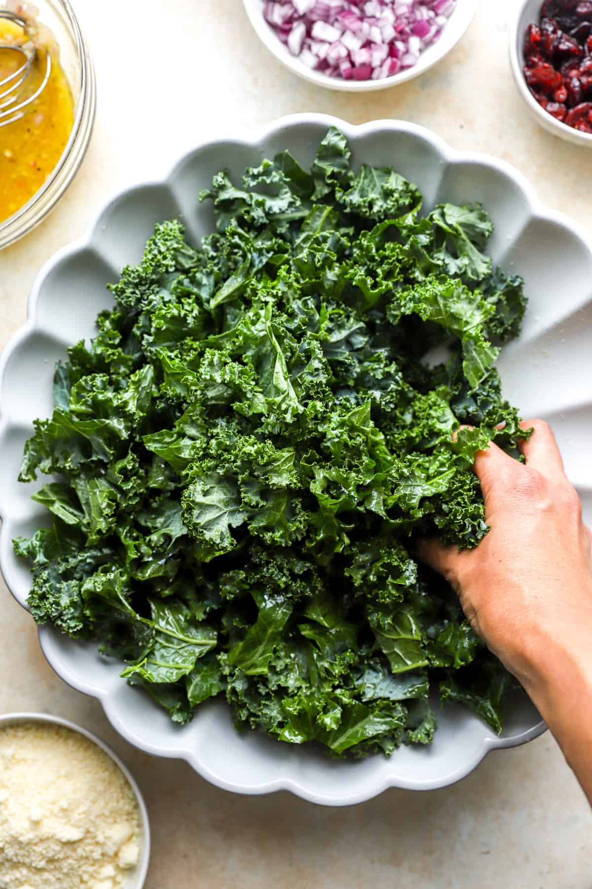 A platter of kale being massaged.