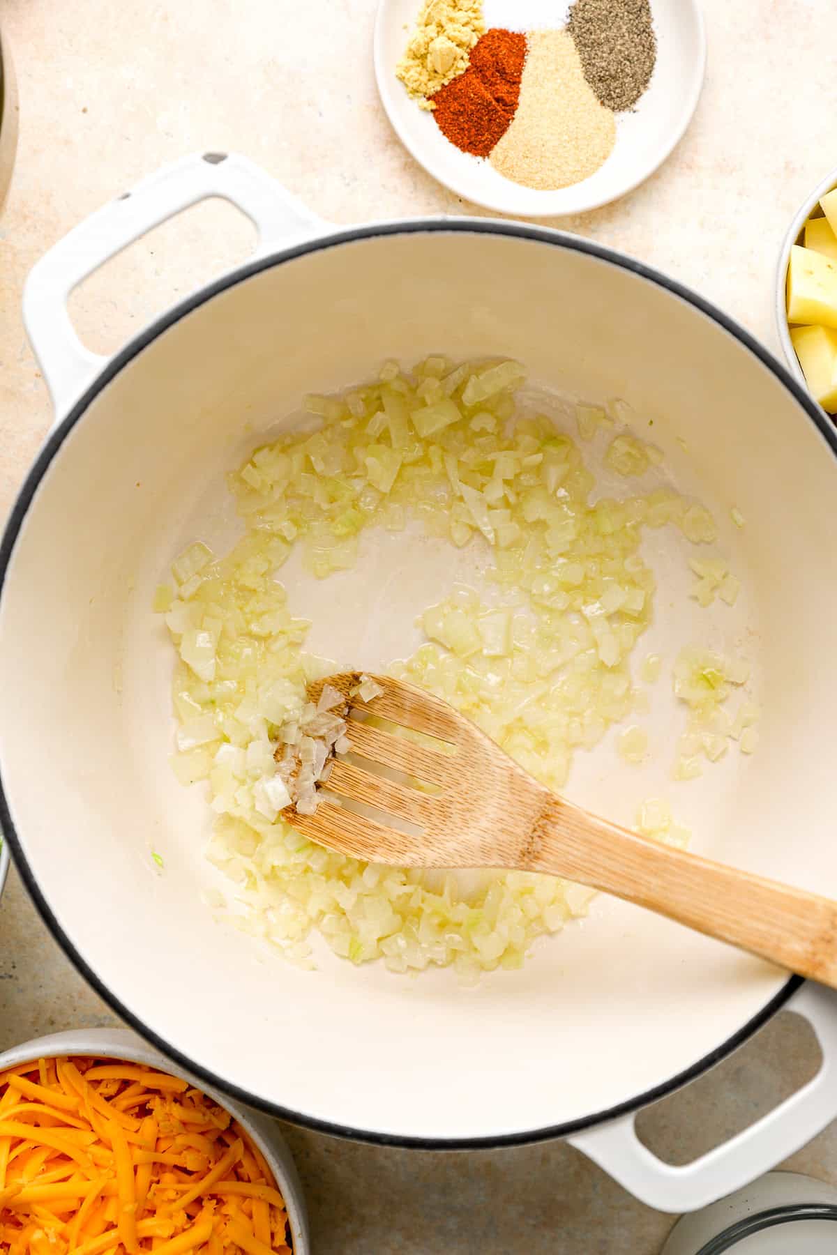 Onions sautéing in a Dutch oven. 
