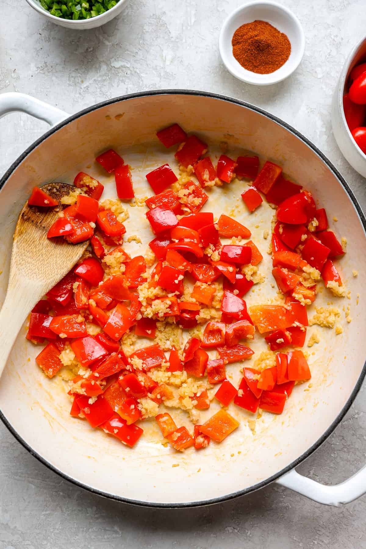 Bell peppers sautéing with garlic. 