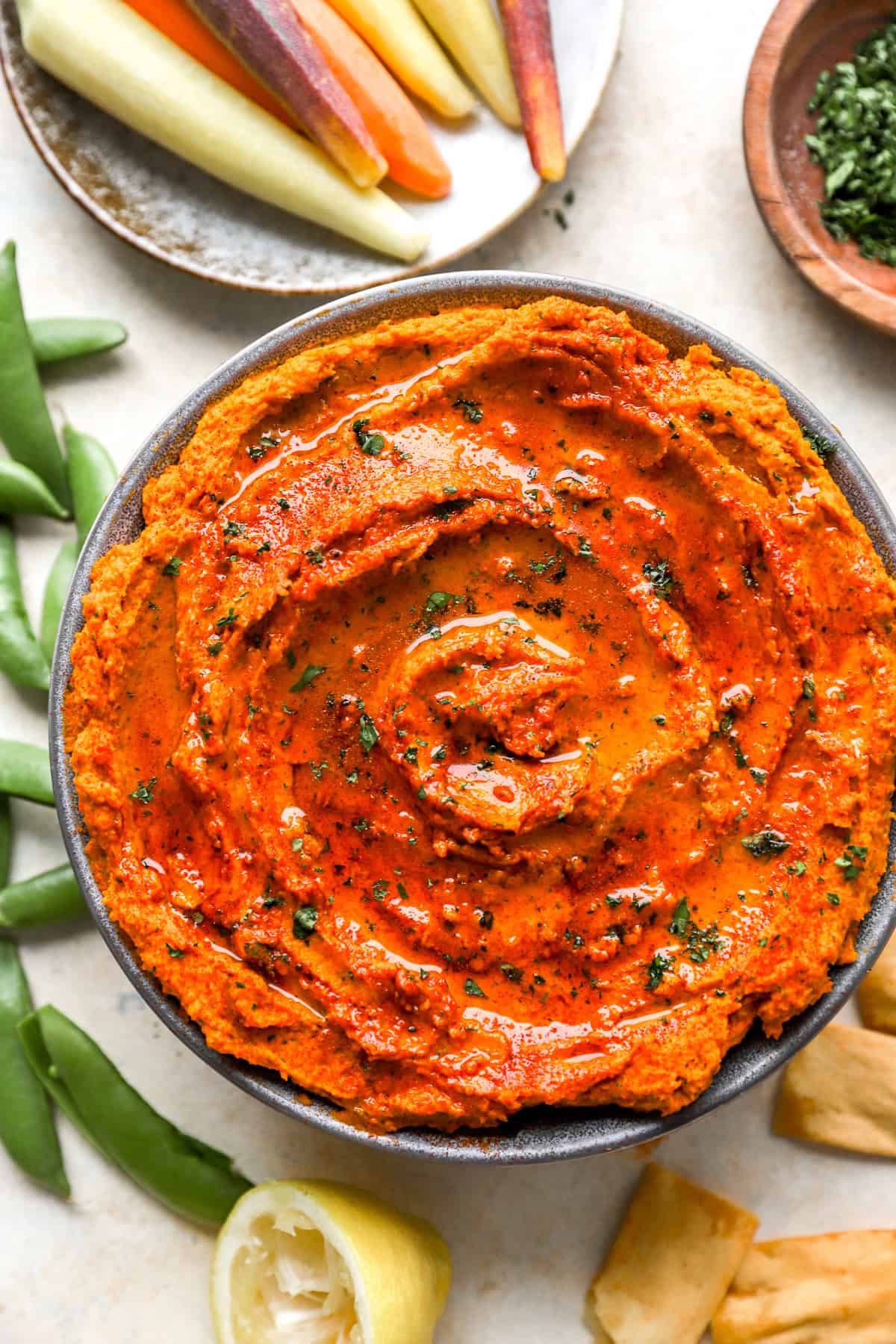 A bowl of roasted carrot hummus.