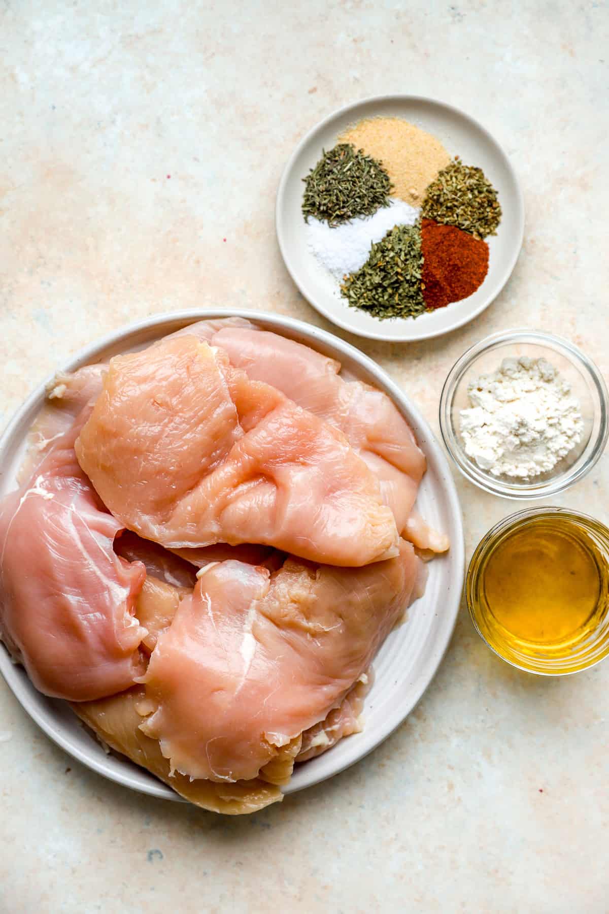 Ingredients to make pan seared chicken skillet cutlets.