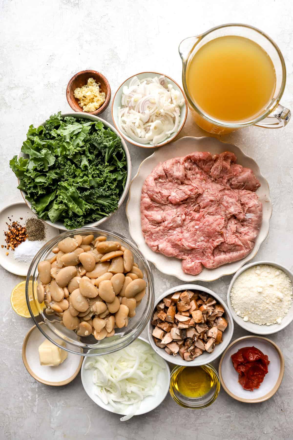 Ingredients to make hot sausage Parmesan butter beans. 