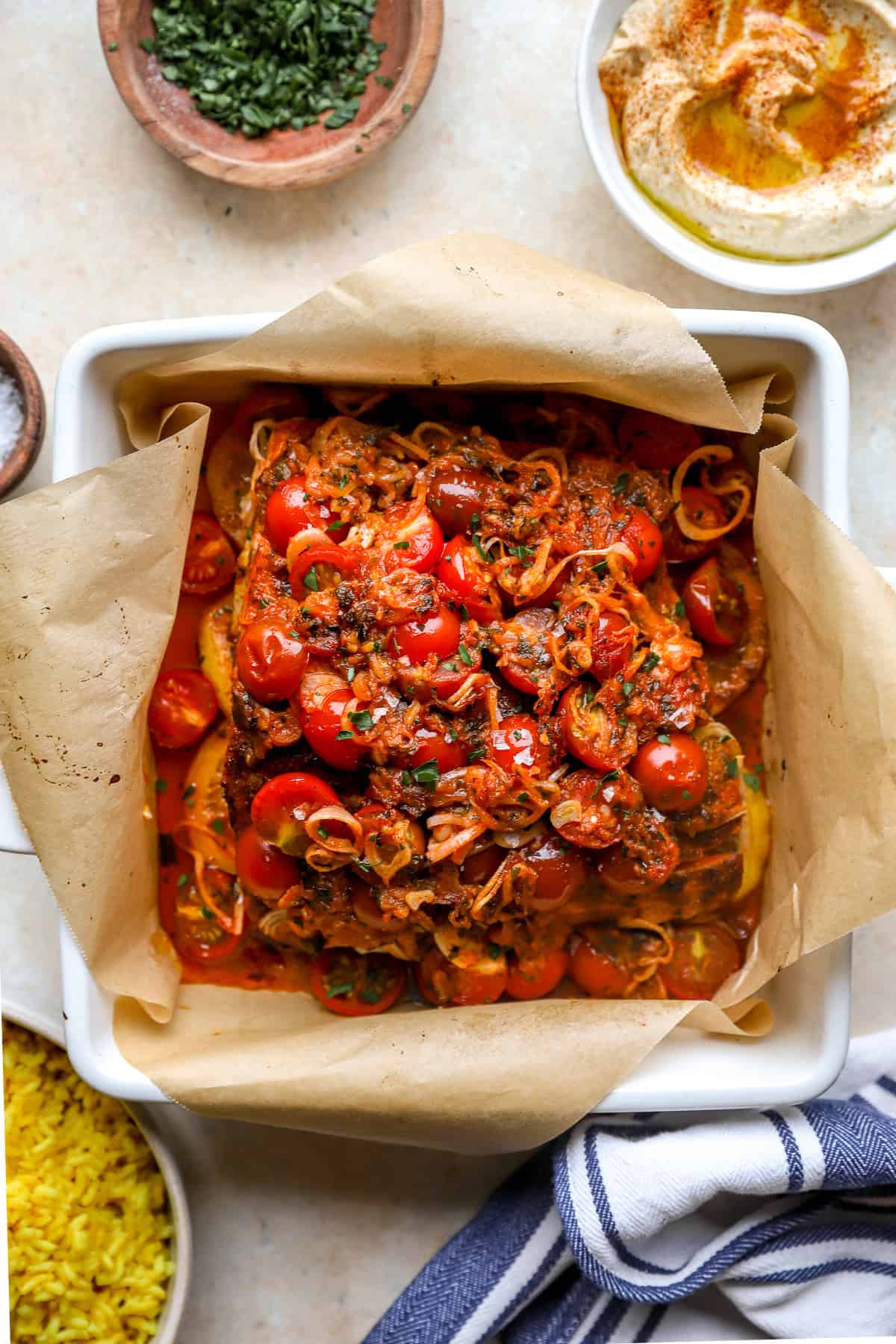 Baked salmon shawarma in a square pan.