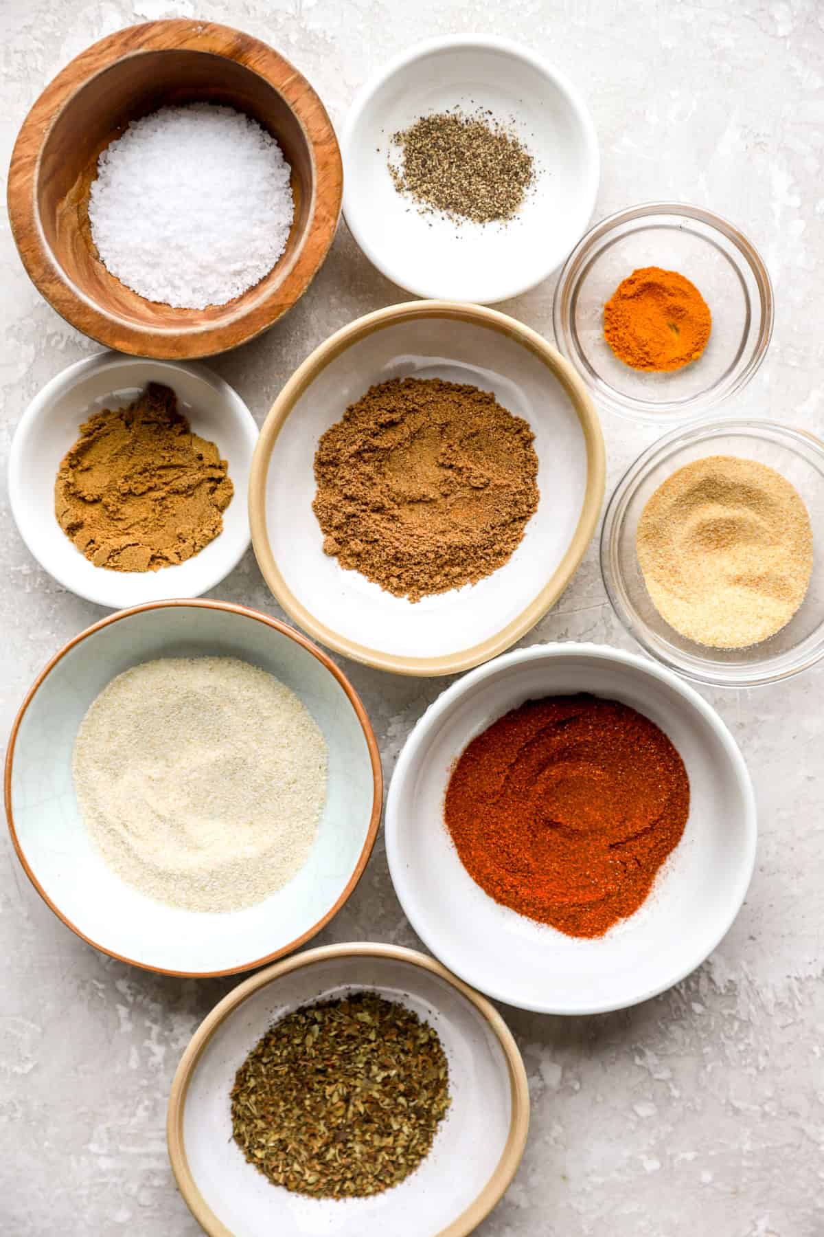 Bowls of spices to make homemade Sazón seasoning.