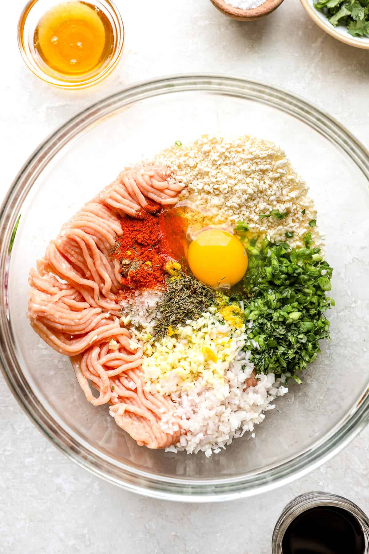 Honey garlic chicken meatball ingredients in a bowl.