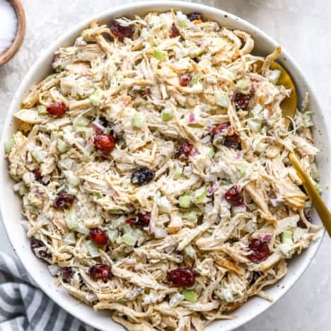 A bowl of classic chicken salad with cranberries.
