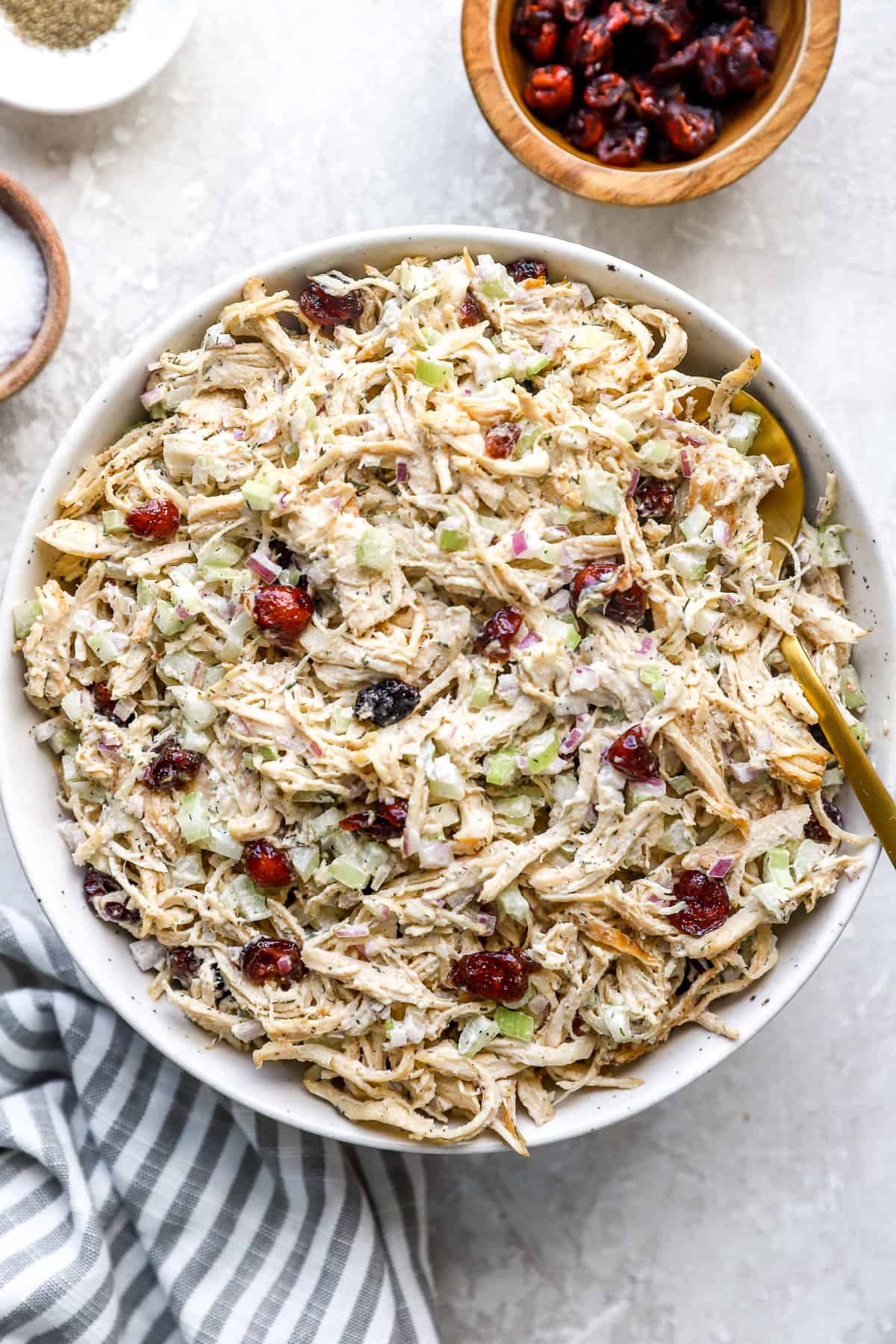 A bowl of classic chicken salad with cranberries.