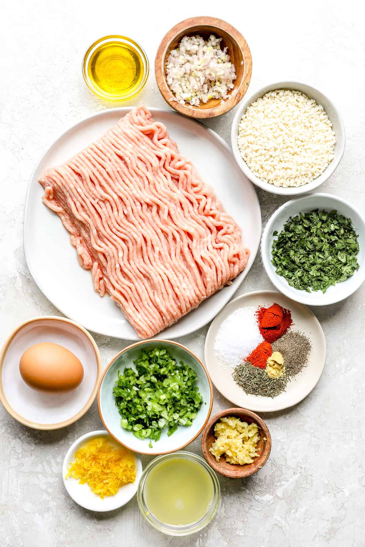 Herby ground chicken burger ingredients.