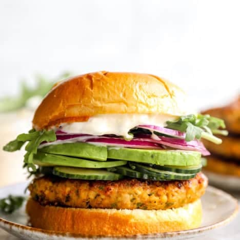 A ground chicken burger on a plate.