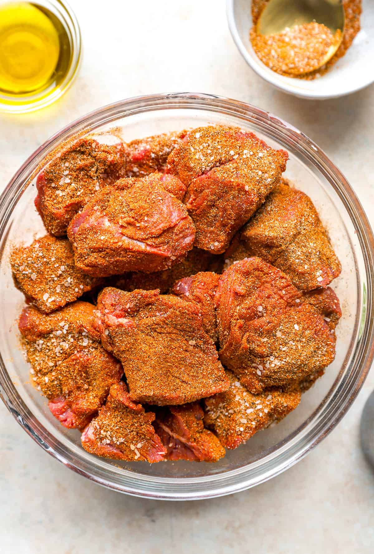 A bowl of seasoned beef cubes.