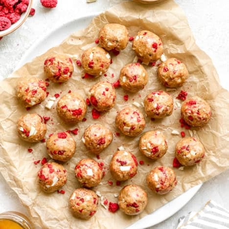 A platter of no-bake raspberry white chocolate protein balls.